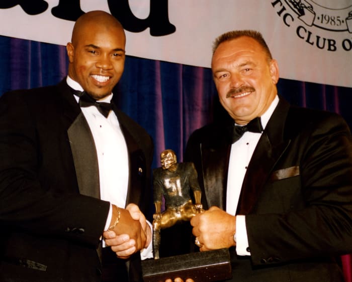 Former Illinois linebacker Kevin Hardy (left) accepting the 1995 Butkus Award from NFL Hall of Fame selection and former Illini great Dick Butkus.